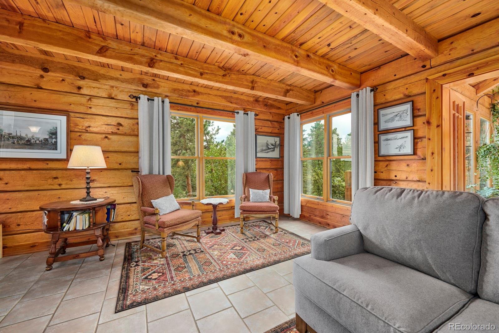 2847 Ridge Road Nederland, CO 80466 - Photo 9 of 40 a living room with furniture and large windows