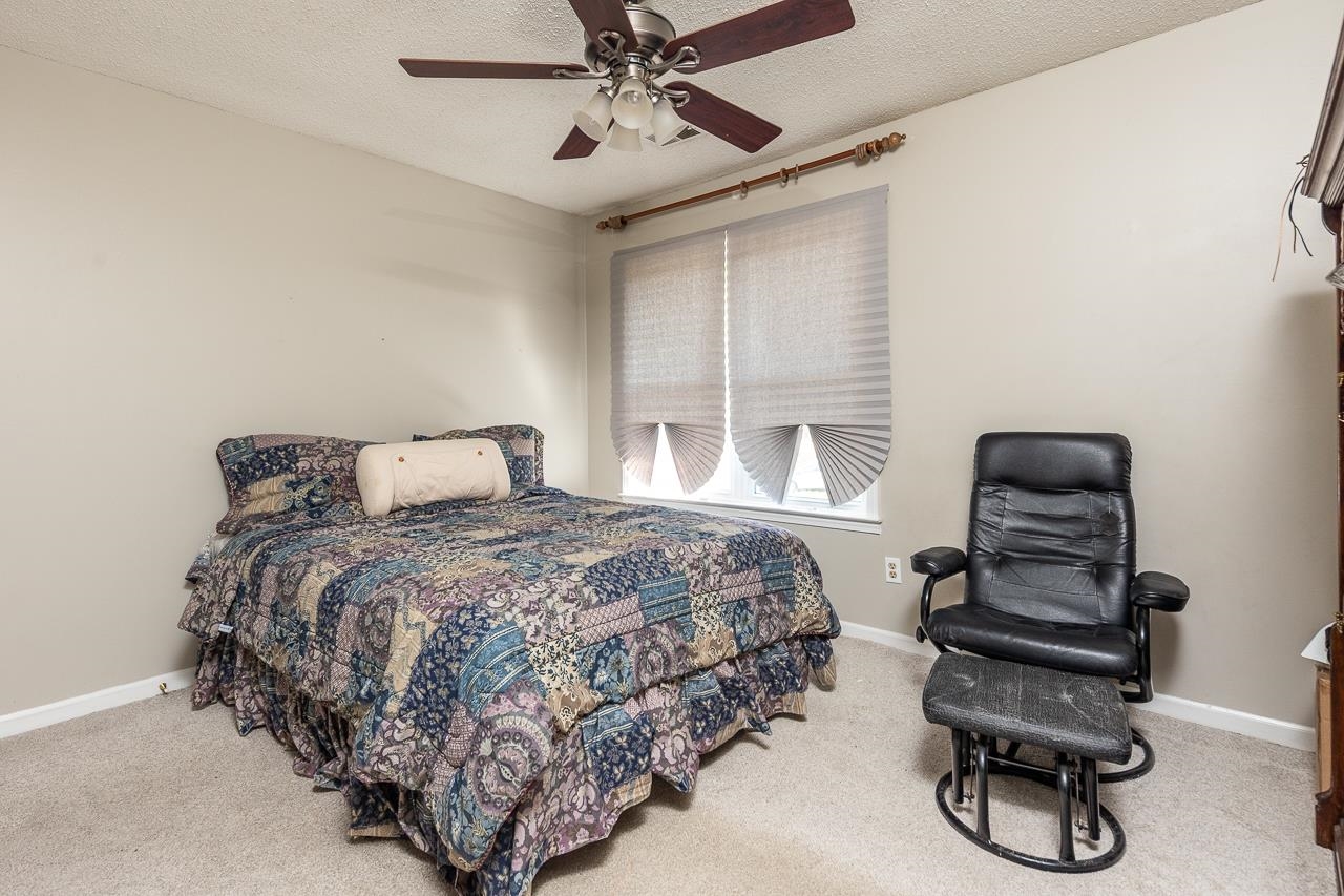 7829 Gateway Inlet Memphis, TN 38119 - Photo 6 of 30 a bedroom with a bed and cabinets