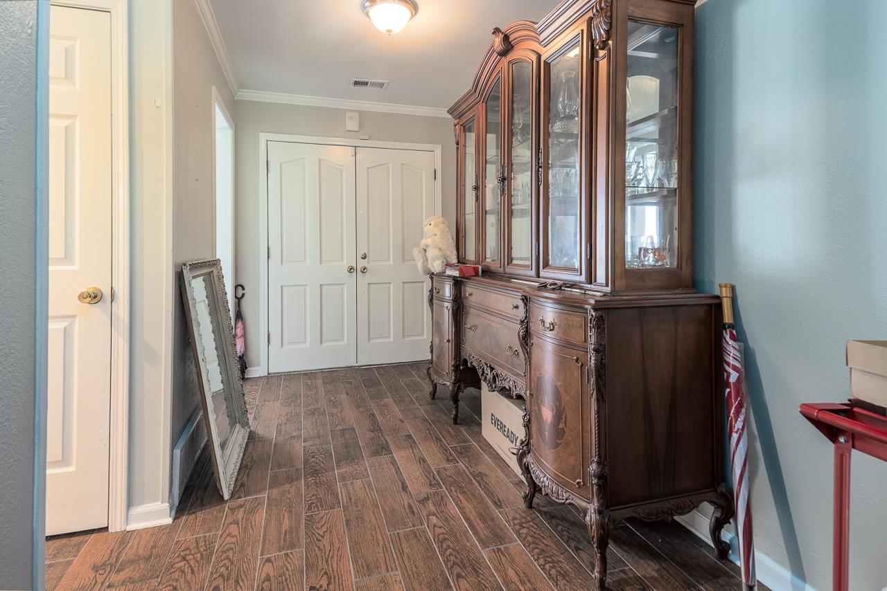 7829 Gateway Inlet Memphis, TN 38119 - Photo 10 of 30 a view of a hallway with wooden floor and staircase
