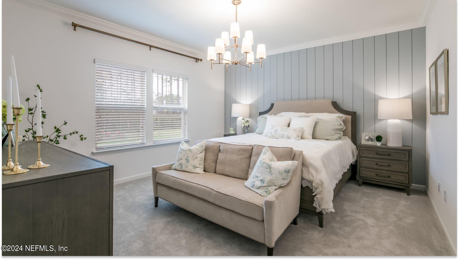 59 Bevins Lane St. Augustine, FL 32092 - Photo 12 of 14 a bedroom with a bed and a chandelier