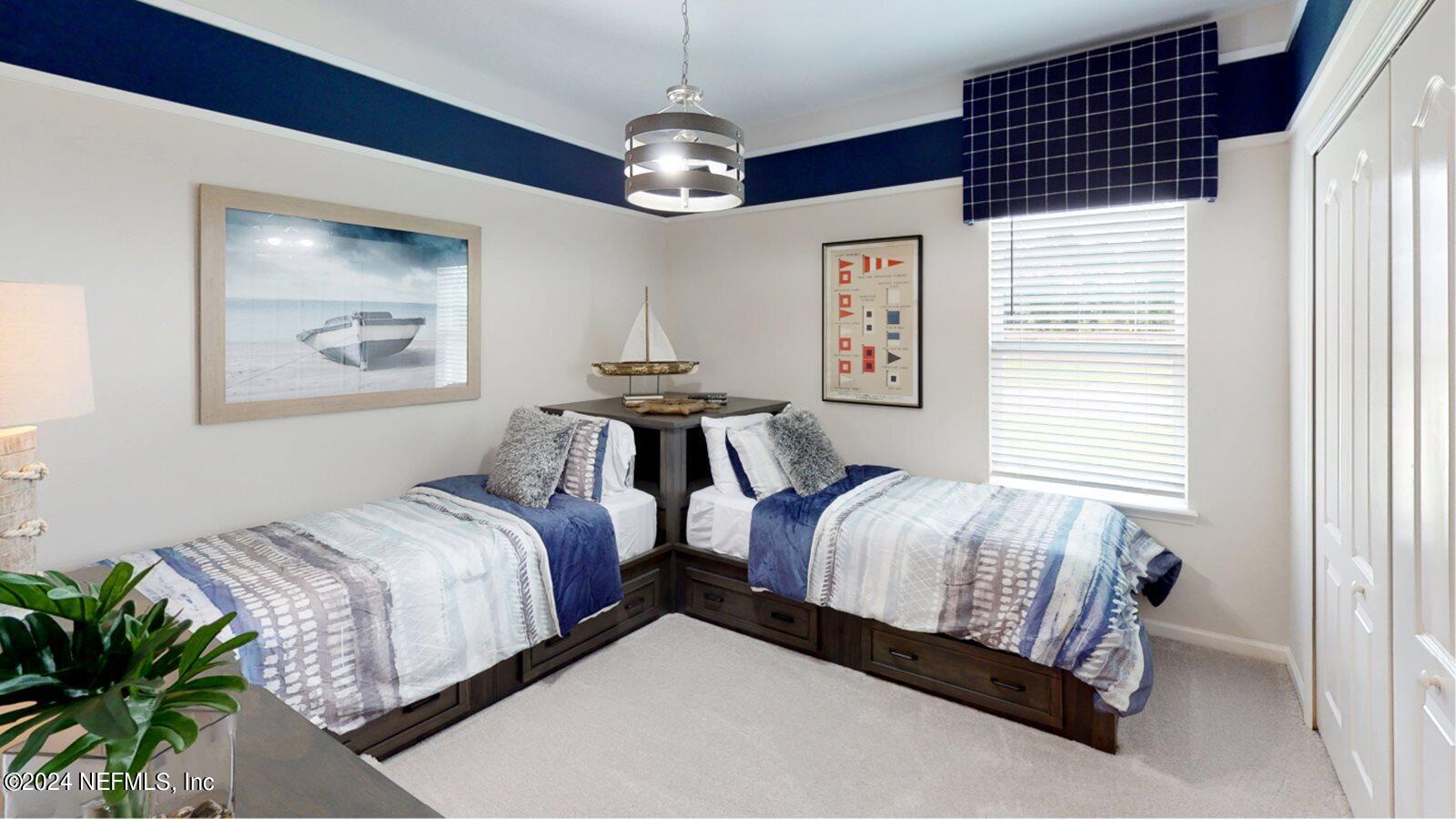 59 Bevins Lane St. Augustine, FL 32092 - Photo 4 of 14 a spacious bedroom with two beds and a chandelier