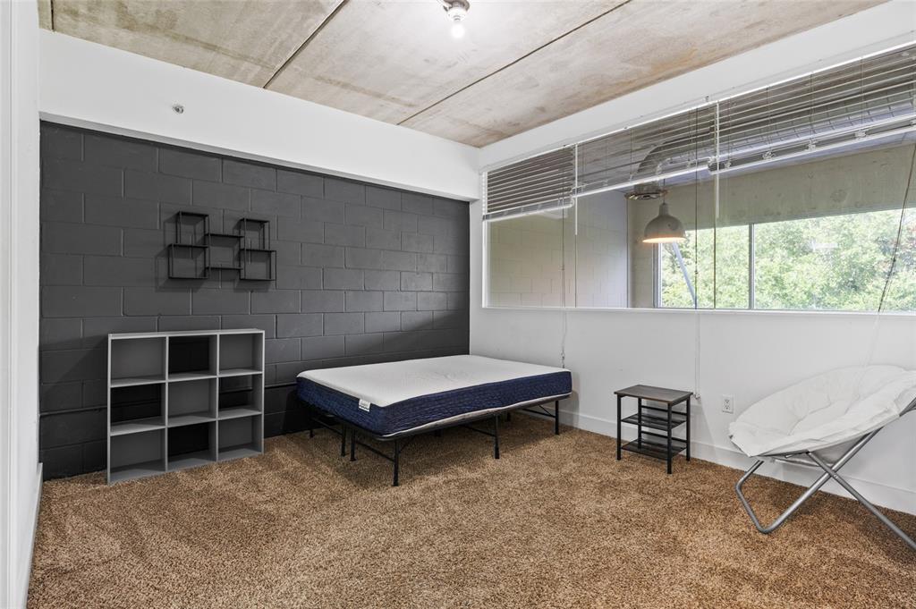 2515 Southwest 35th Place, Unit 203 Gainesville, FL 32608 - Photo 18 of 22 a room with furniture and window