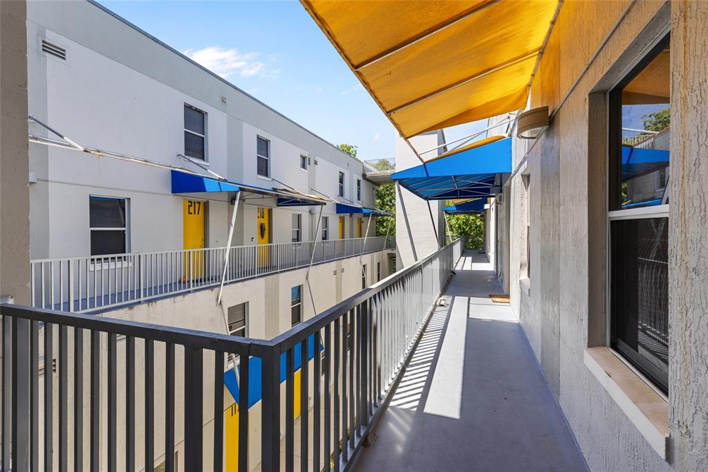 2515 Southwest 35th Place, Unit 203 Gainesville, FL 32608 - Photo 4 of 22 a view of staircase with wooden floor and stairs