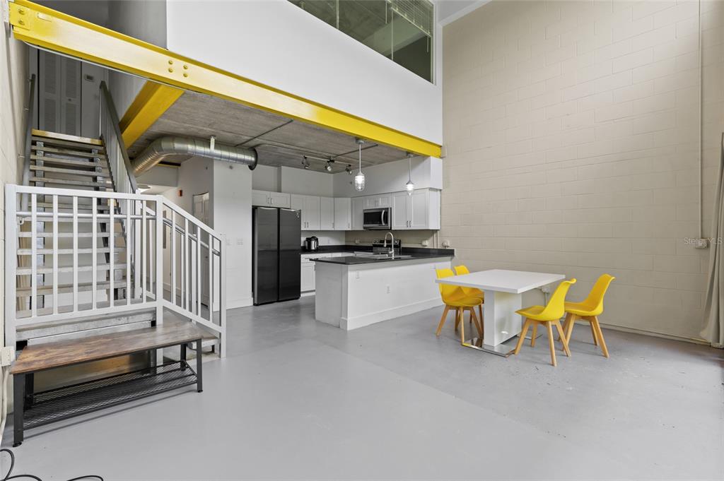 2515 Southwest 35th Place, Unit 203 Gainesville, FL 32608 - Photo 9 of 22 a kitchen with a table and chairs