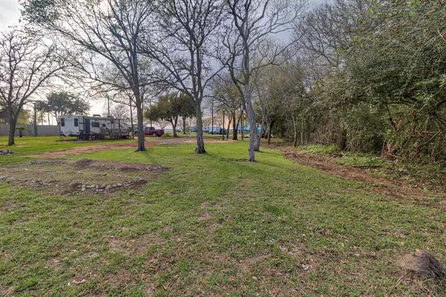 a huge green field with lots of trees