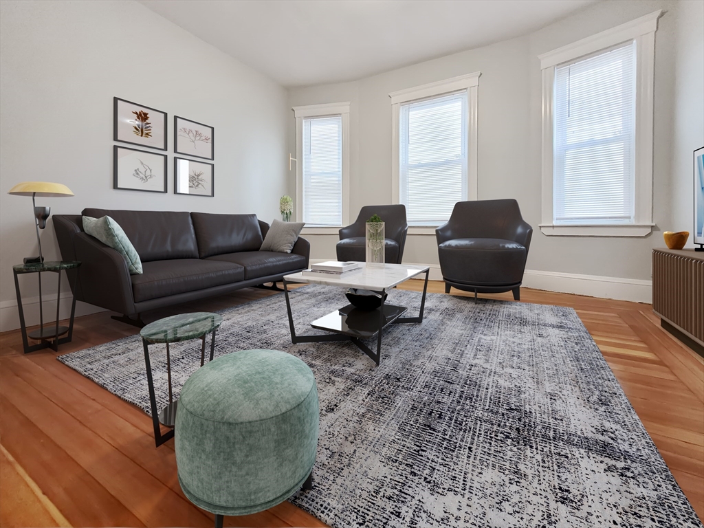 108 Callender Street, Unit 3 Boston, MA 02124 - Photo 2 of 12 a living room with furniture and a rug