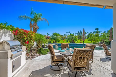 a view of a chairs and table on the terrace