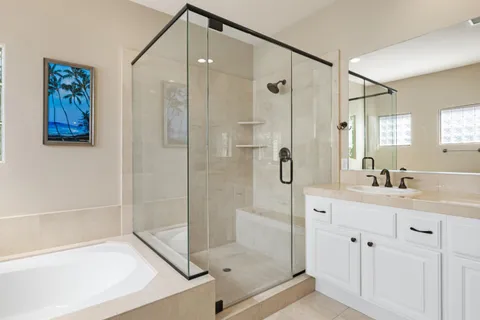 a bathroom with a shower sink and mirror