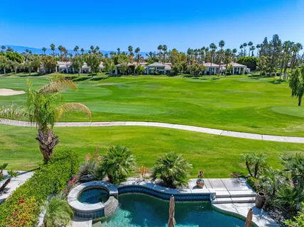 a view of a chair and tables in the garden