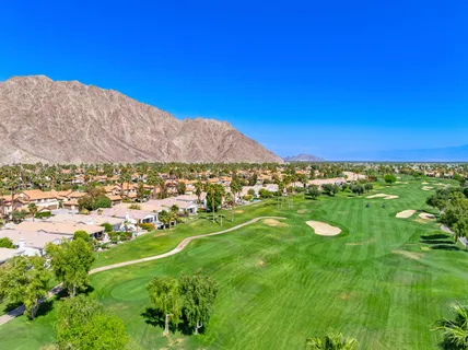 a view of a city with a houses in the background