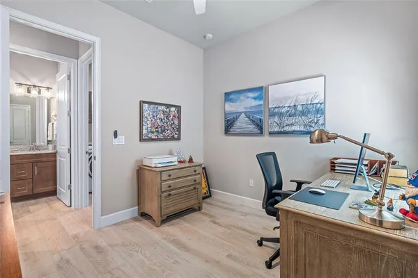 a bedroom with two beds and painted walls