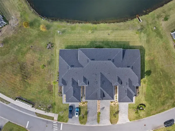 an aerial view of residential houses with outdoor space
