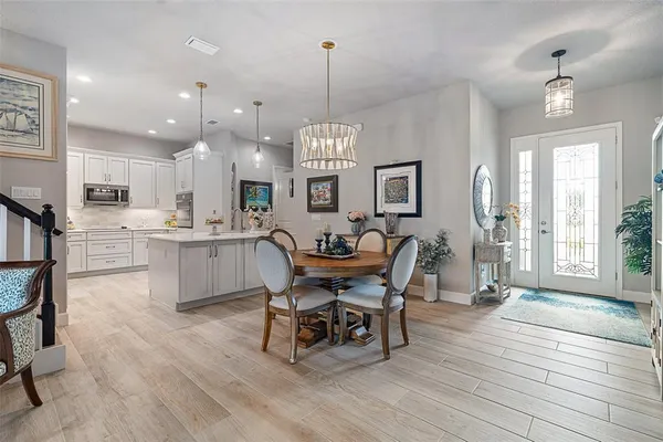 a kitchen with stainless steel appliances a stove and cabinets