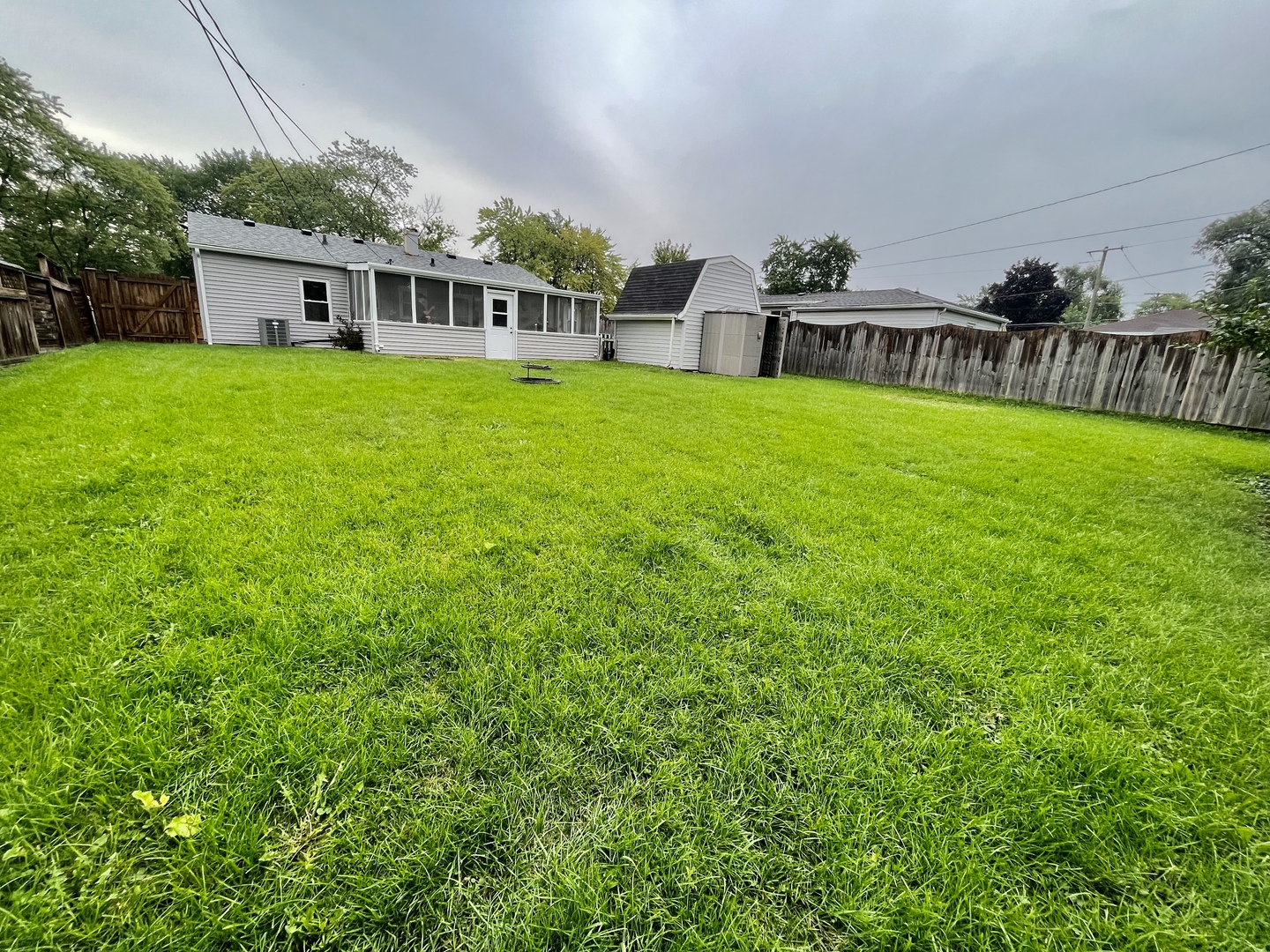 207 MacGregor Road Lockport, IL 60441 - Photo 14 of 14 a view of a house with a backyard and a patio