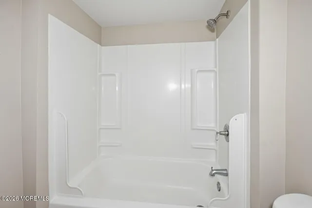 a close view of a bathtub in bathroom