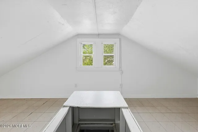 a room with a bed and a window