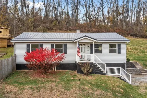 a front view of a house with yard