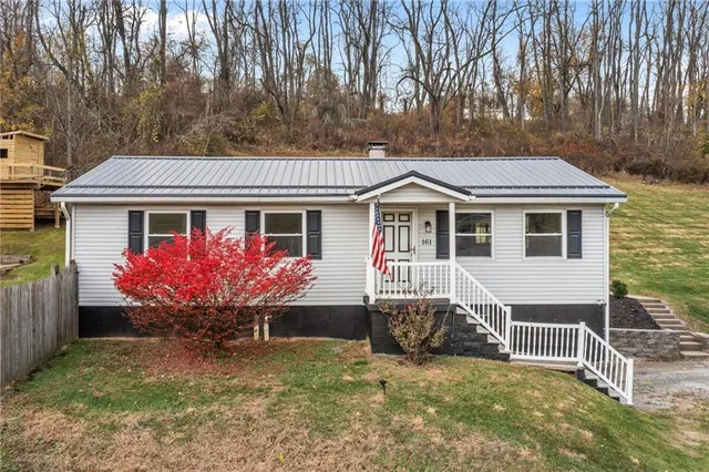 a front view of a house with yard