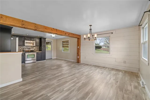 a view of a kitchen with a sink and a stove