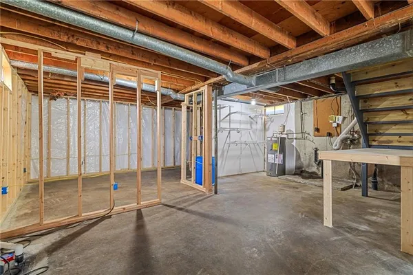 a view of an empty room with wooden walls