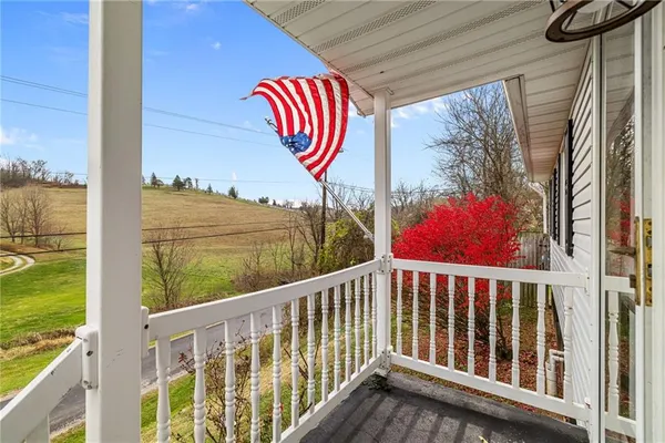 a view of balcony with furniture
