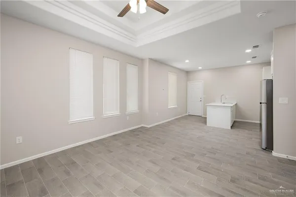 a view of an empty room with a window