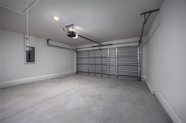 a view of empty room with white walls