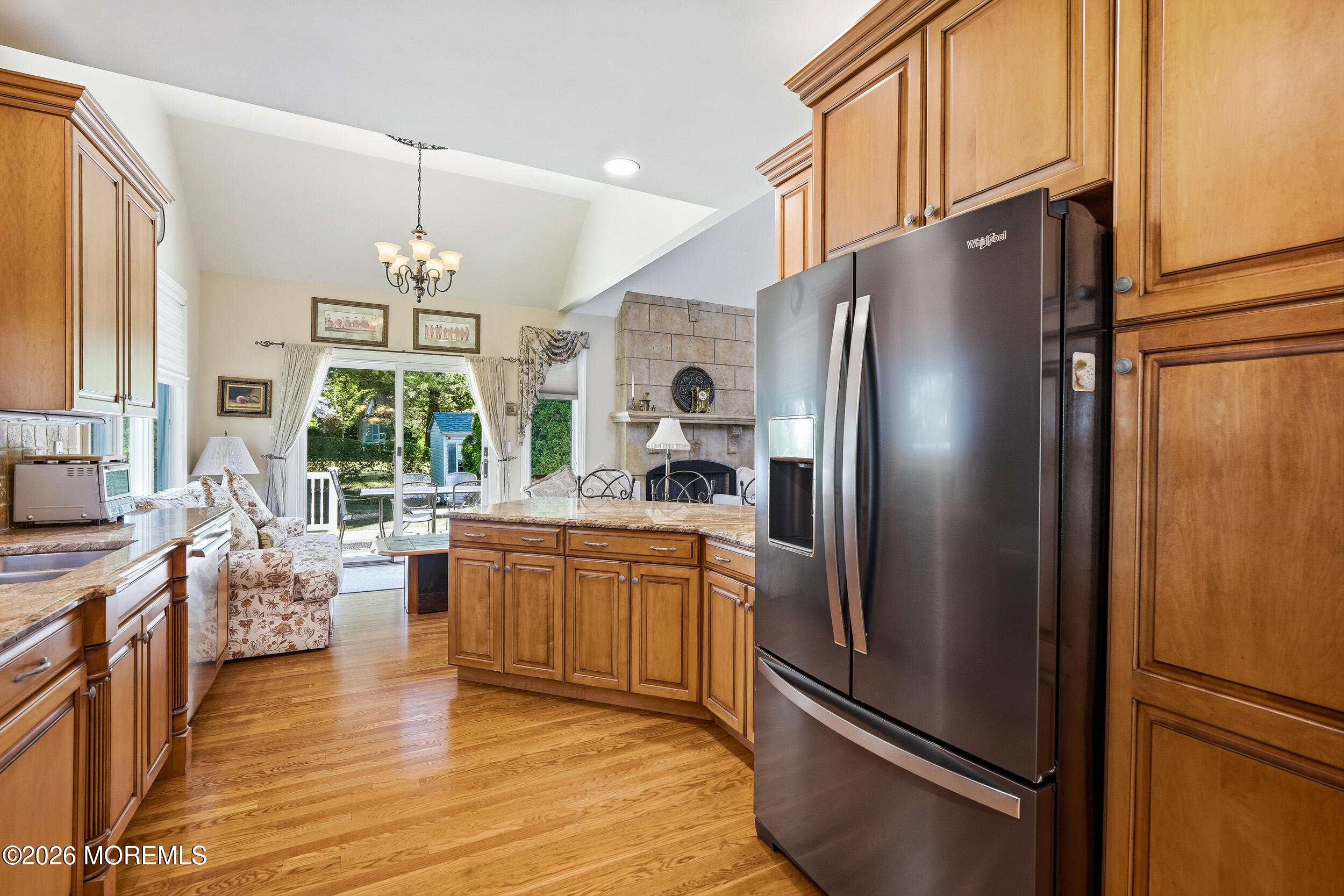 478 Rickey Lane Long Branch, NJ 07740 - Photo 30 of 64 a kitchen with stainless steel appliances granite countertop a refrigerator a stove a sink dishwasher a oven with a dining table and chairs