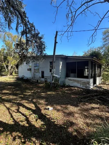 a view of a yard with a tree