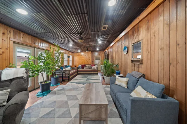 a lobby with furniture and potted plants
