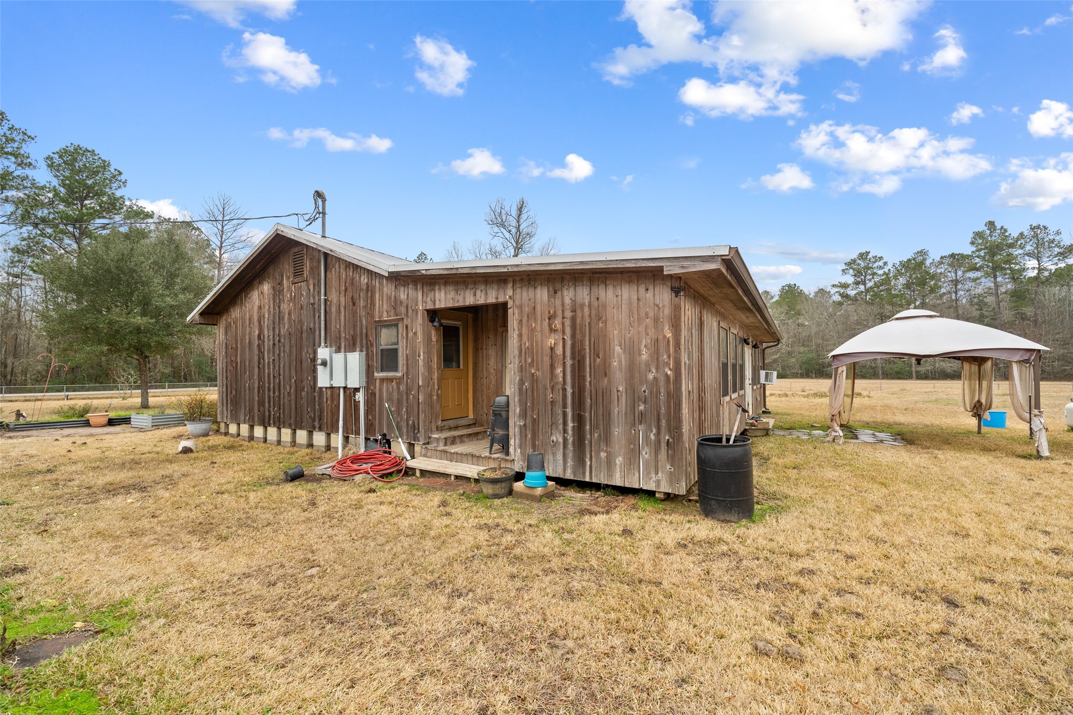 31 Shady Lane Shepherd, TX 77371 - Photo 19 of 31 a view of a house with backyard and trees