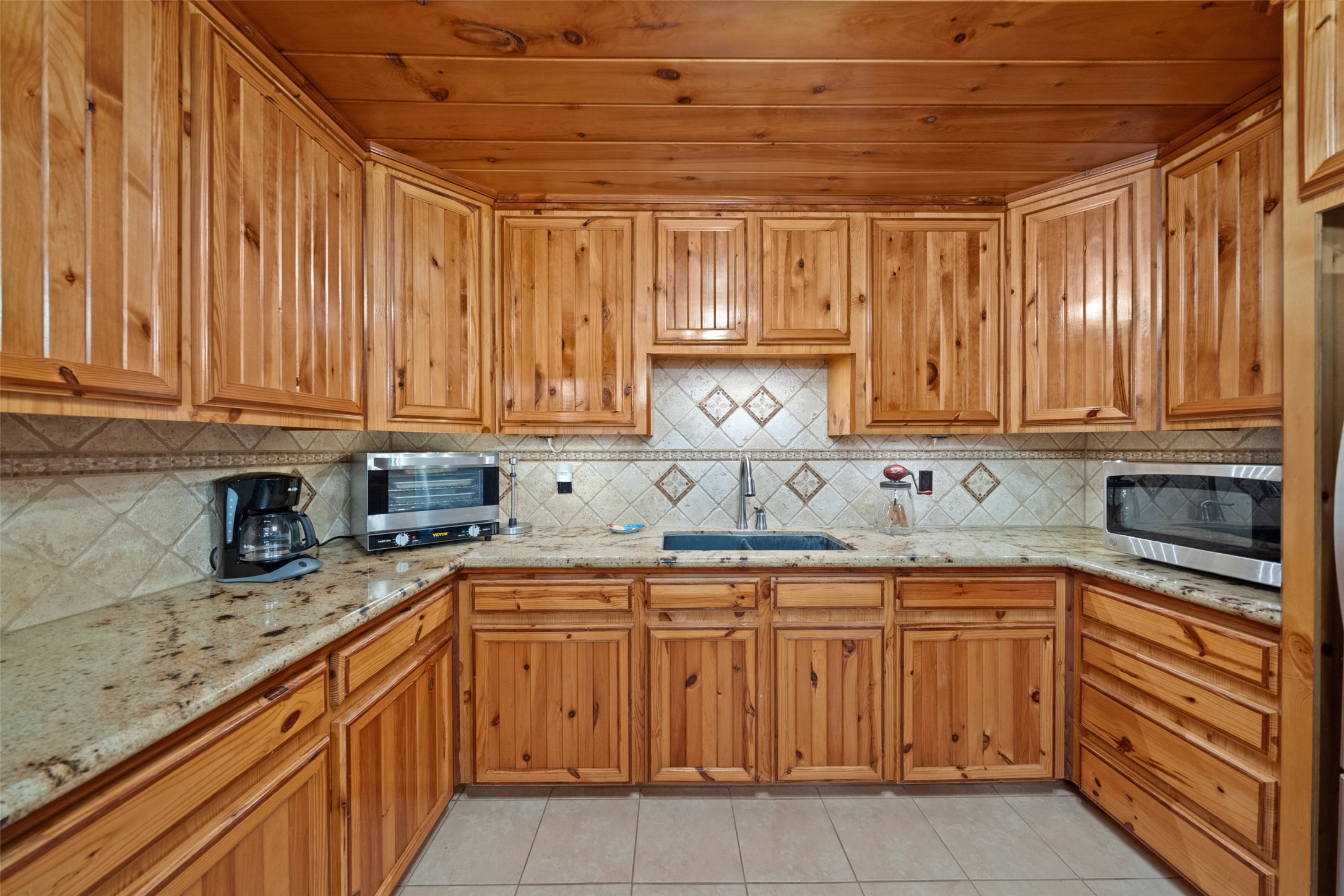 31 Shady Lane Shepherd, TX 77371 - Photo 9 of 31 a kitchen with a sink and cabinets