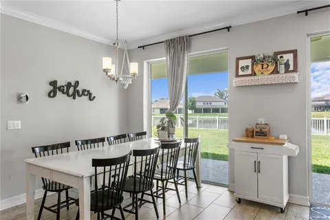 a kitchen with refrigerator and cabinets