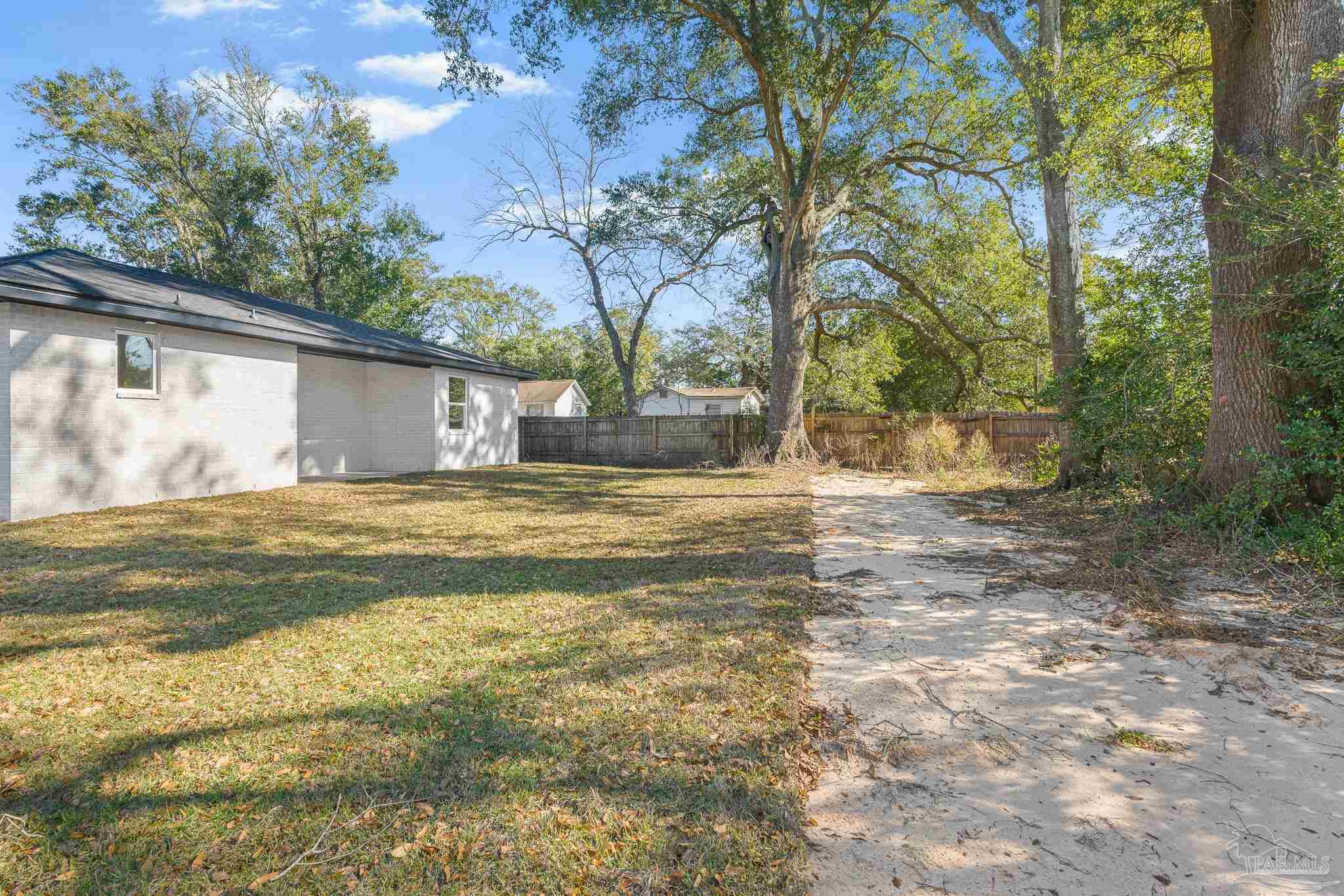 5005 Saufley Field Road Pensacola, FL 32526 - Photo 26 of 27 a view of a house with a yard