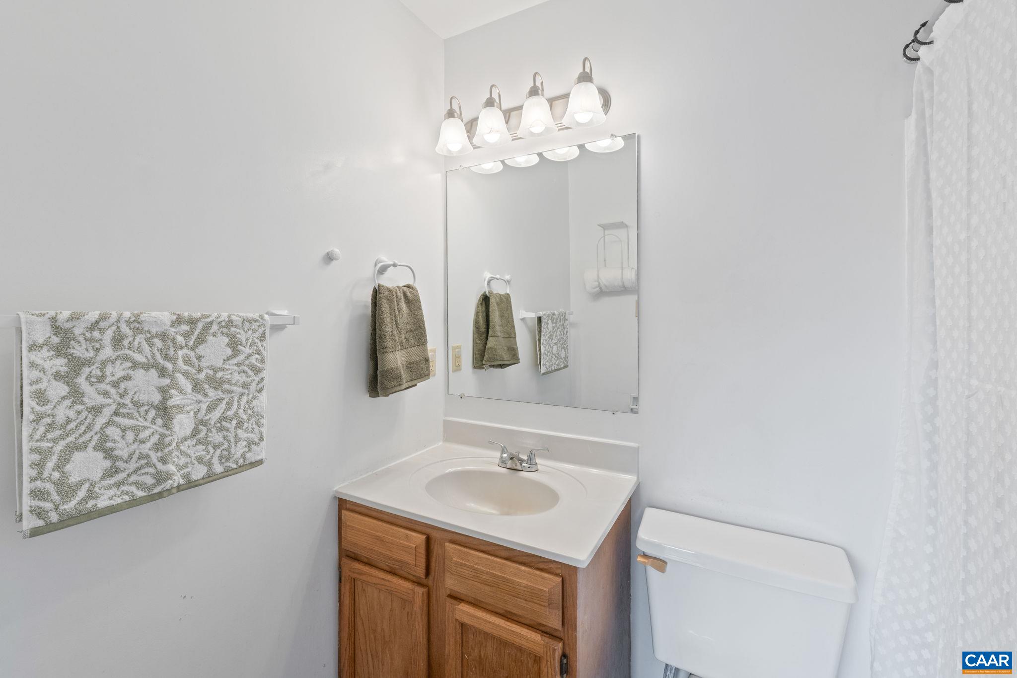 401 Riverside Avenue Charlottesville, VA 22902 - Photo 18 of 36 a bathroom with a sink and a mirror