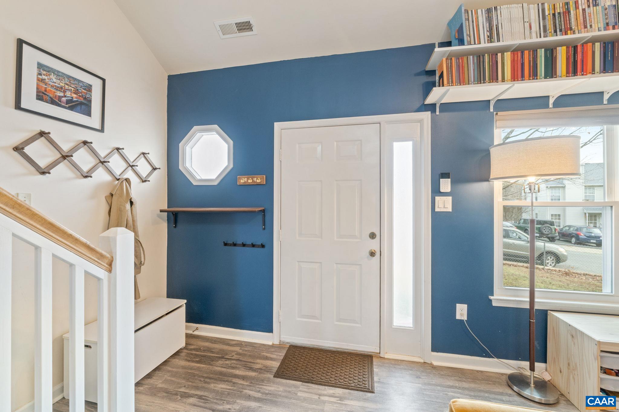 401 Riverside Avenue Charlottesville, VA 22902 - Photo 4 of 36 a view of a hallway with entryway and wooden floor