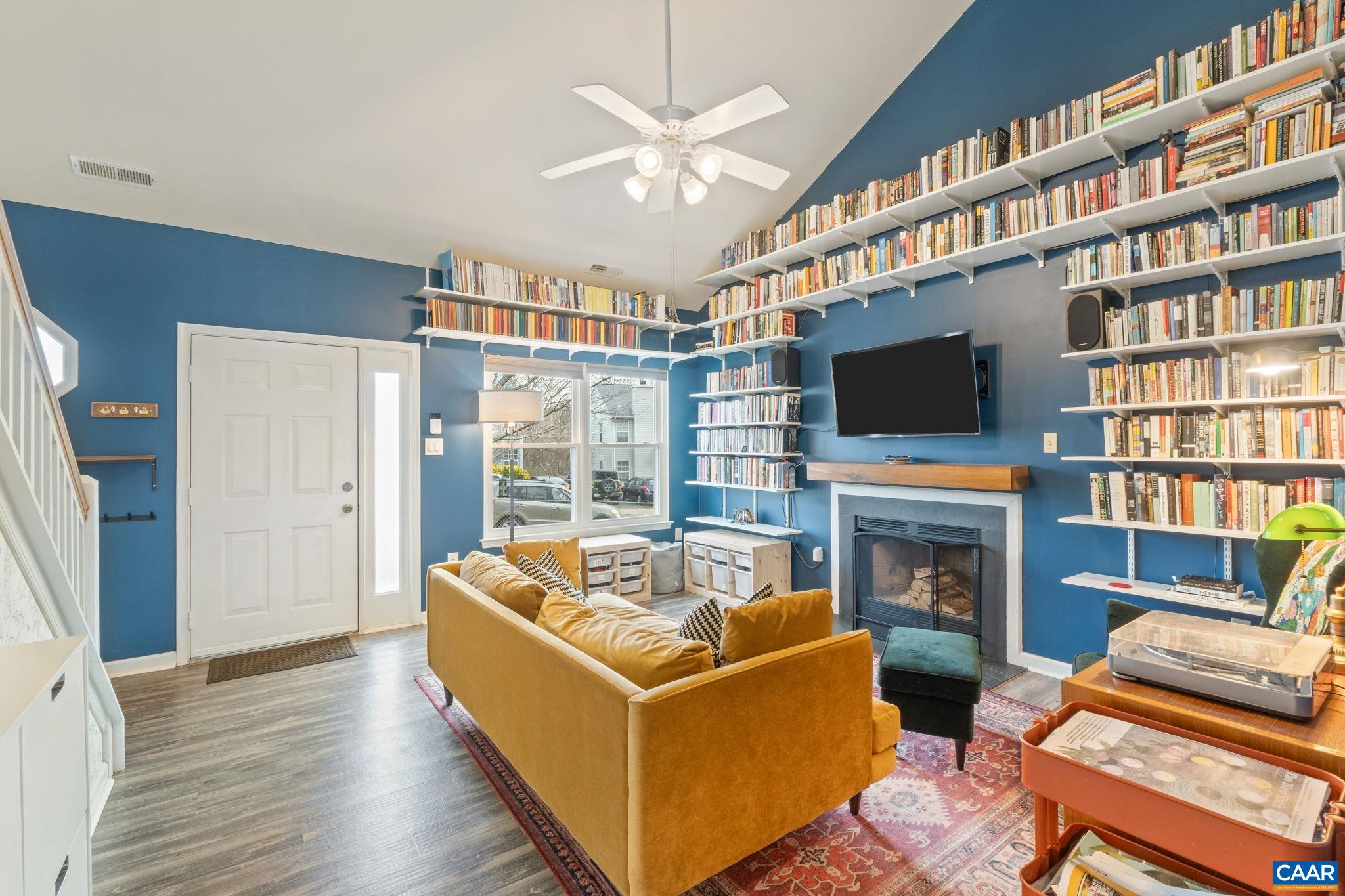 401 Riverside Avenue Charlottesville, VA 22902 - Photo 5 of 36 a living room with furniture fireplace and a flat screen tv