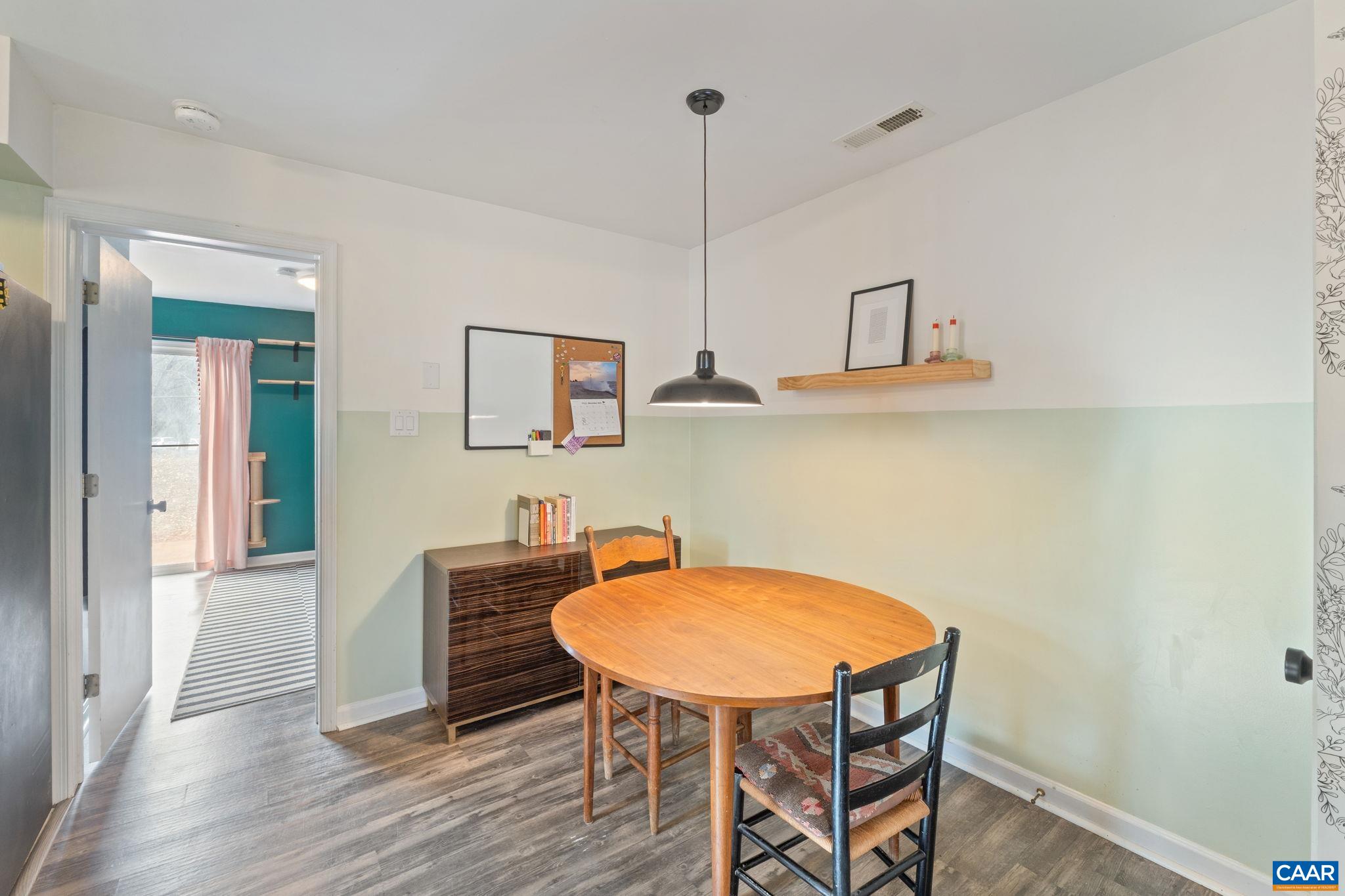 401 Riverside Avenue Charlottesville, VA 22902 - Photo 9 of 36 a view of a dining room with furniture and wooden floor