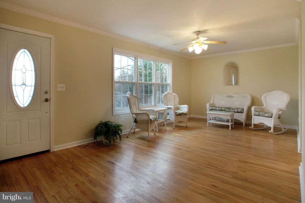 1010 Bernoudy Road White Hall, MD 21161 - Photo 13 of 28 a living room with furniture and a chandelier