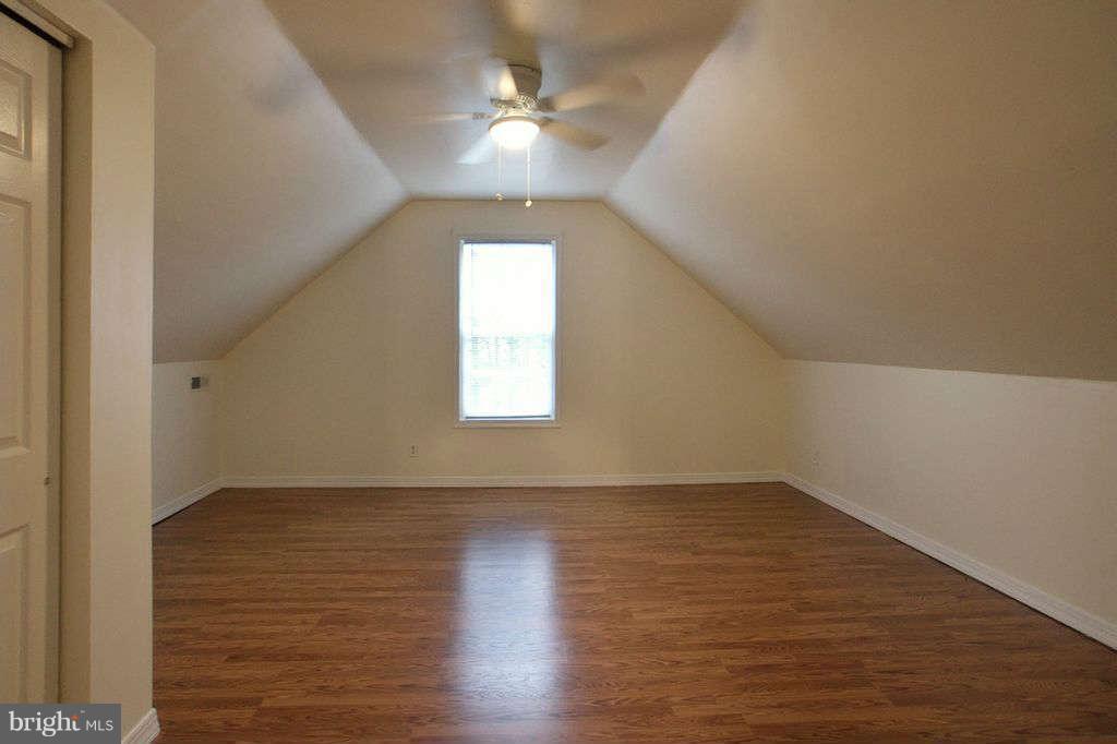 1010 Bernoudy Road White Hall, MD 21161 - Photo 15 of 28 wooden floor in an empty room with a window