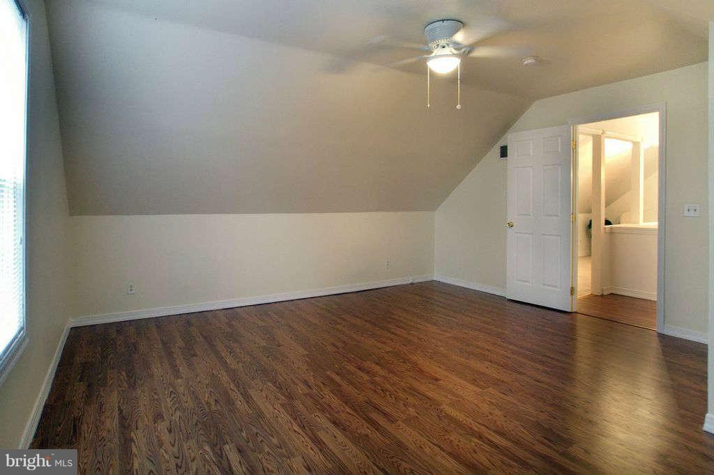 1010 Bernoudy Road White Hall, MD 21161 - Photo 16 of 28 wooden floor in an empty room with a window