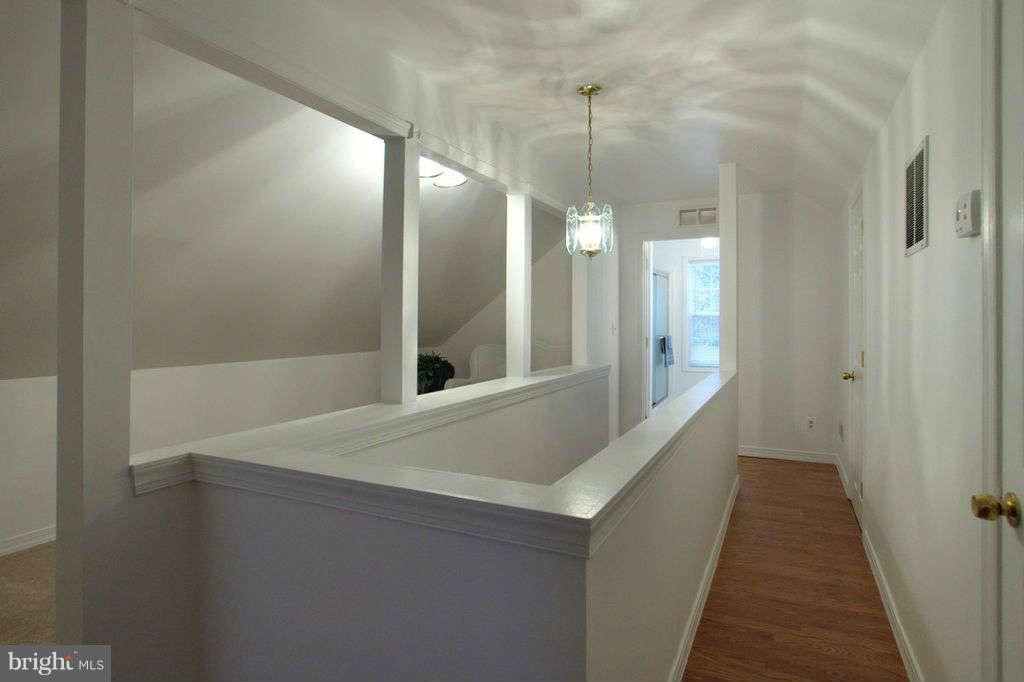 1010 Bernoudy Road White Hall, MD 21161 - Photo 17 of 28 a view of a hallway with wooden floor