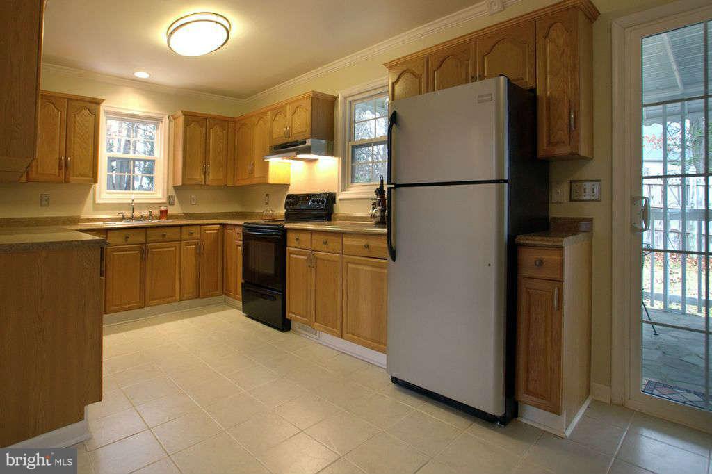 1010 Bernoudy Road White Hall, MD 21161 - Photo 7 of 28 a kitchen with stainless steel appliances granite countertop a refrigerator a sink and a stove