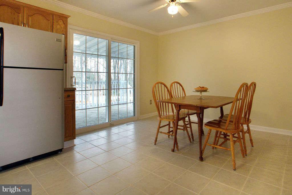 1010 Bernoudy Road White Hall, MD 21161 - Photo 8 of 28 a view of a dining room with furniture and a chandelier