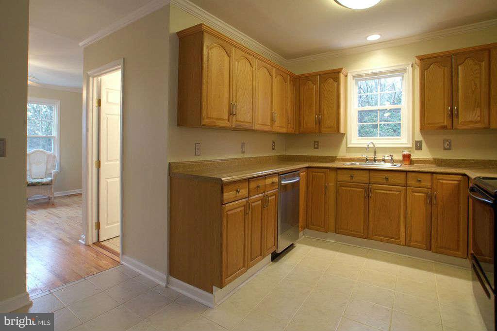 1010 Bernoudy Road White Hall, MD 21161 - Photo 9 of 28 a kitchen with a sink stove and cabinets