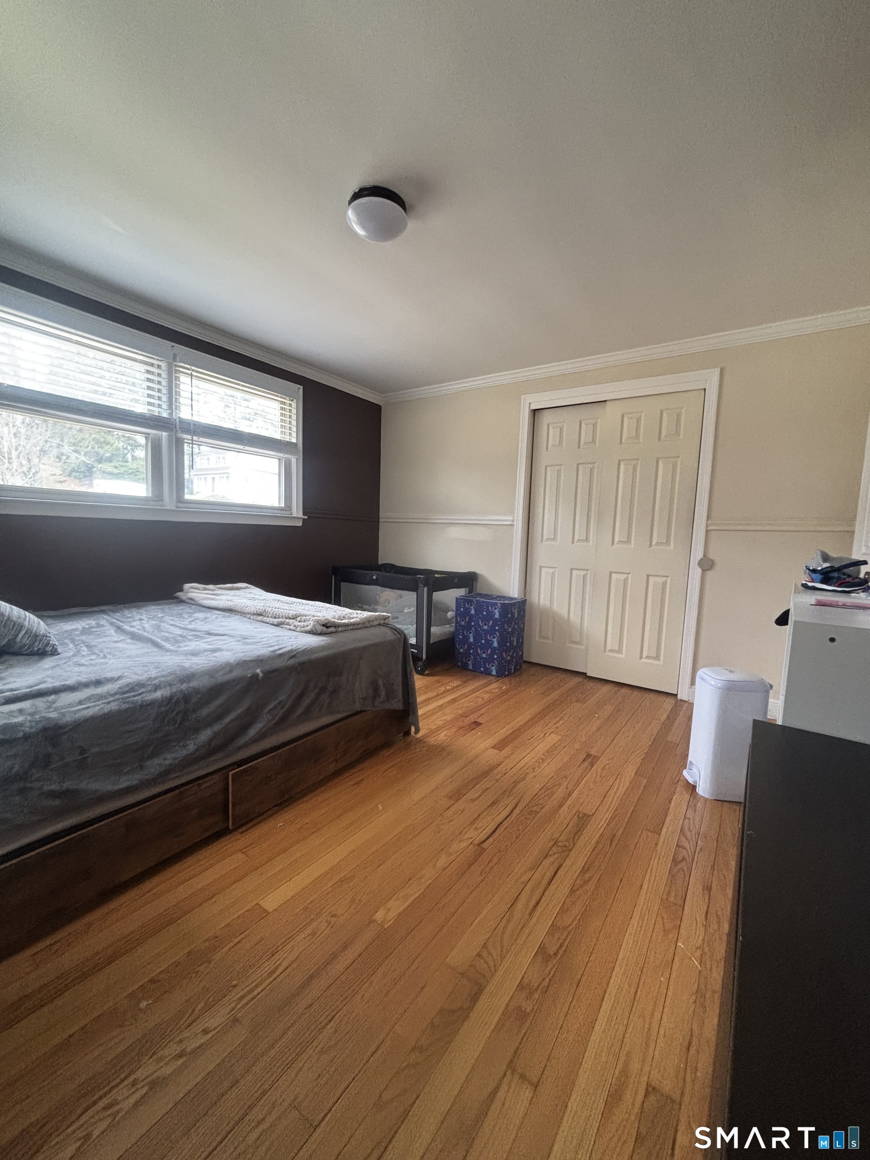 117 Arden Road Waterbury, CT 06708 - Photo 15 of 30 a bedroom with a bed and wooden floor
