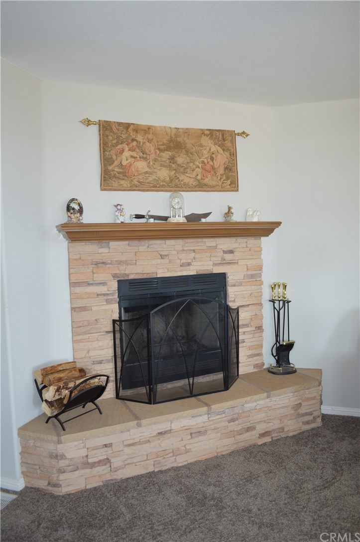 39423 Grassy Road Temecula, CA 92592 - Photo 11 of 39 Woodburning fireplace in family room