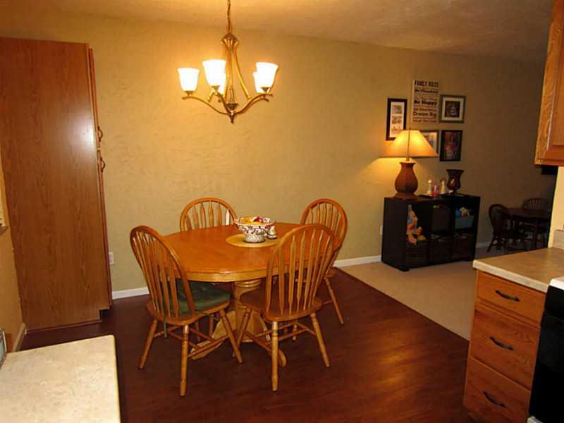 1357 Cavitt Road Monroeville, PA 15146 - Photo 6 of 25 Dining Room. The Dining Area and Kitchen have Newer Wood Laminate Flooring.