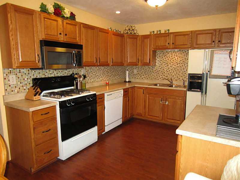 1357 Cavitt Road Monroeville, PA 15146 - Photo 7 of 25 Kitchen. The Kitchen boasts ample Counter and Cabinet Space. The Recessed Lighting shines off the Lovely New Glass Tile Backsplash.