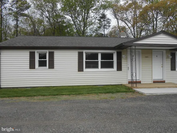 a backyard of a house with garage